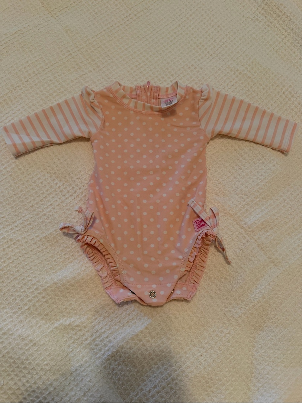Ruffle Butts Pink Polka Dot Rashguard One-Piece with Striped Sleeves